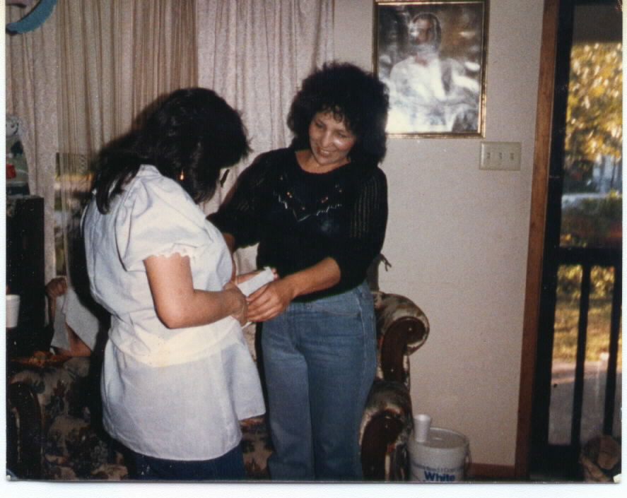 This is a picture of my grandma and my pregnant mom {I think that's me in there}